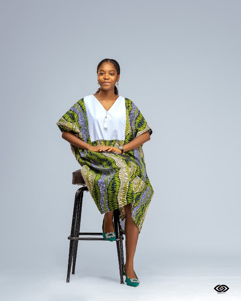 Cladaura Founder wearing a handcrafted modest Afro textile dress